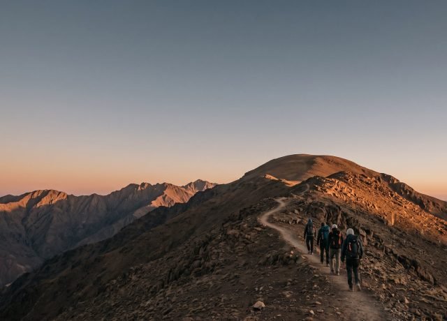 Climbers on the Toubkal summit ridge at dawn